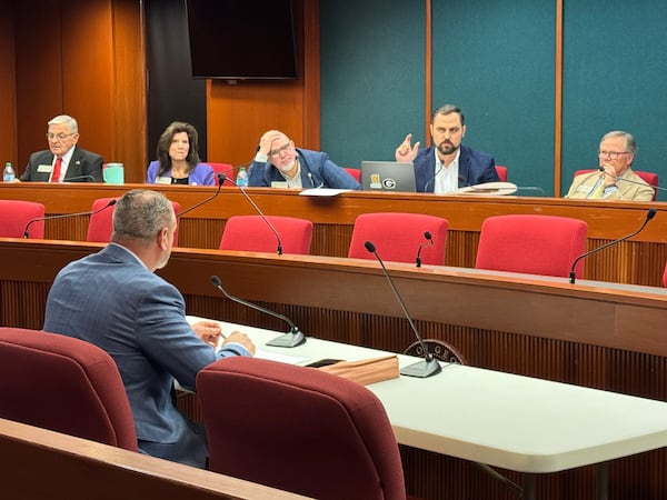 State Rep. Martin Momtahan (second from right) questioned state Rep. Derrick McCollum during a public hearing at the Capitol in Atlanta on Monday. (Adam Beam/AJC)
