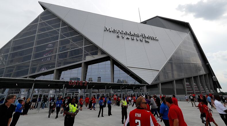 Fans enter the gates prior to the game between the Atlanta Falcons and the Arizona Cardinals at Mercedes-Benz Stadium on August 26, 2017 in Atlanta, Georgia.  (Photo by Kevin C. Cox/Getty Images)