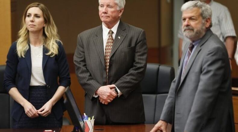 <p>Tex McIver stands with attorneys Amanda Clark Palmer (left) and Don Samuel to face the jury as they concluded their fourth day of deliberations today during the Tex McIver murder trial at the Fulton County Courthouse and will resume on Monday.</p>