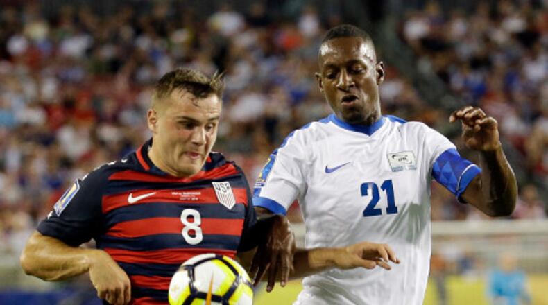 United States' Jordan Morris (8) moves the ball past Martinique's Sebastien Cretinoir (21) during a CONCACAF Gold Cup soccer match, Wednesday, July 12, 2017, in Tampa, Fla. (AP Photo/John Raoux) ORG XMIT: TPS121