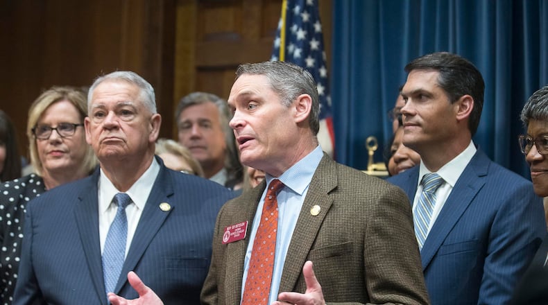 Georgia Speaker of the House David Ralston, left, and Lt. Gov. Geoff Duncan, right, listen during a press conference as state Rep. Ed Setzler, the author of the state’s new anti-abortion “heartbeat” law, thanks his supporters following its signing by Gov. Brian Kemp. (ALYSSA POINTER/ALYSSA.POINTER@AJC.COM)