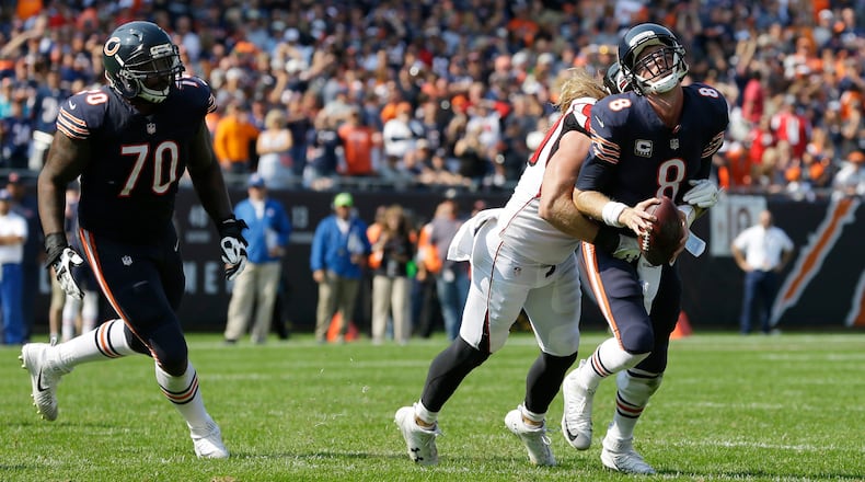 Chicago Bears quarterback Mike Glennon (8) is sacked by Atlanta Falcons defensive end Brooks Reed (50) during the second half of an NFL football game, Sunday, Sept. 10, 2017, in Chicago. (AP Photo/Michael Conroy)