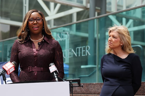 Georgia Supreme Court candidate Miracle Rankin, left, speaks at a news conference on voting rights as Georgia Supreme Court candidate Jen Jordan looks on outside of the Fulton County Government Center in Atlanta last month. (Arvin Temkar/AJC)