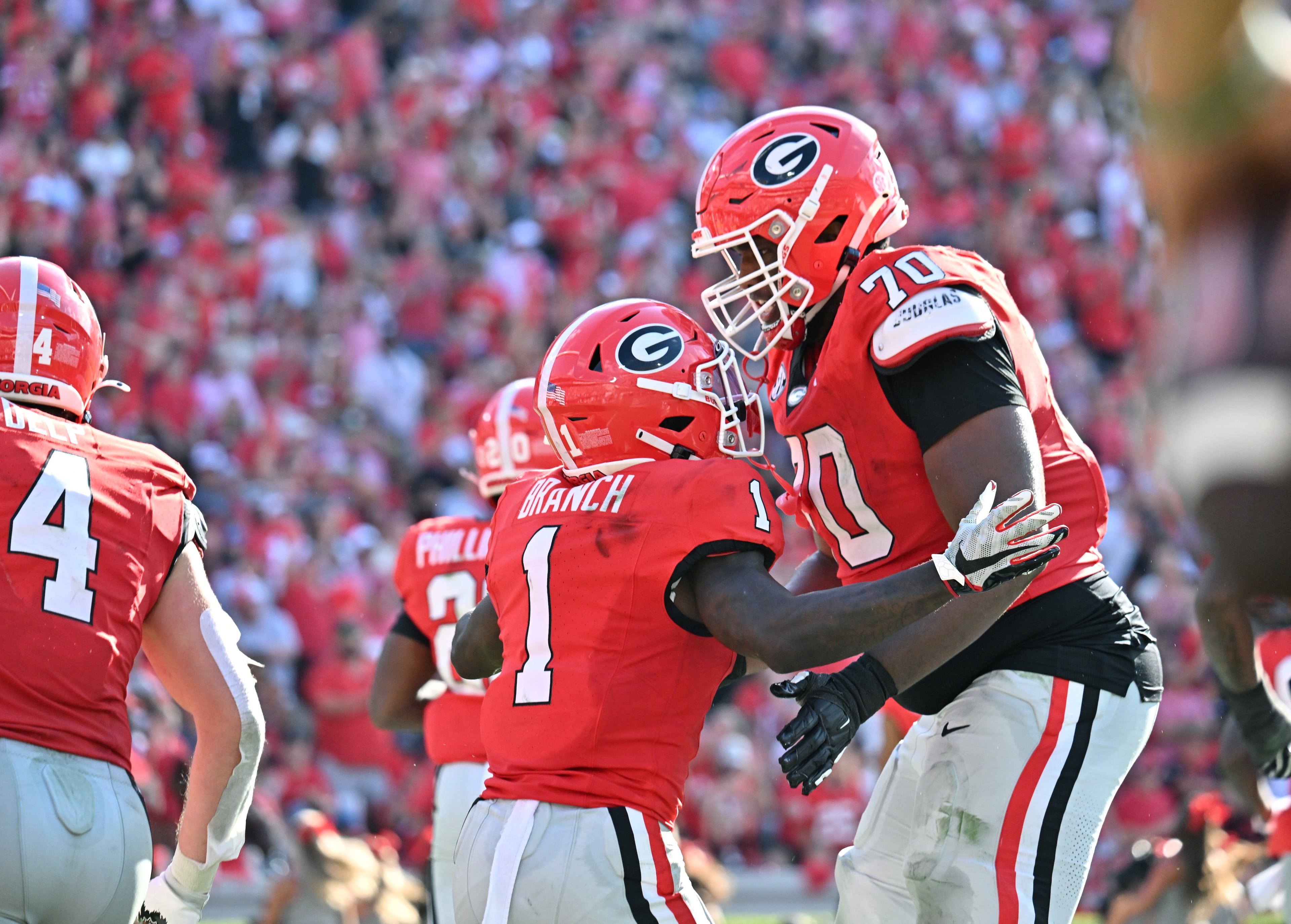 Georgia wide receiver Zachariah Branch (1) celebrates with a teammates after scoring a touchdown during the second half in an NCAA football game at Sanford Stadium, Saturday, August 30, 2025, in Athens. Georgia won 45-7 overMarshall. (Hyosub Shin / AJC)