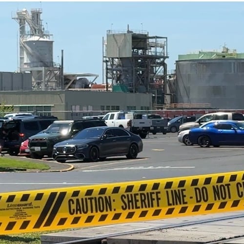 FILE - Yellow police tape is seen on May 27, 2026 outside the Longview, Wash. paper mill where a deadly chemical tank failure occurred. (AP Photo/Claire Rush, File)