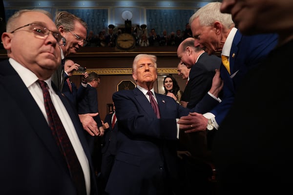 President Donald Trump enters the U.S. House chamber before addressing a joint session of Congress in Washington last March. (TNS)
