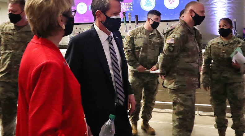 Governor Brian Kemp, Dr. Kathleen Toomey, Commissioner Georgia DPH, and U.S. Army personnel along with members of the Federal Emergency Management Agency (FEMA), the Georgia Emergency Management Agency (GEMA), Fulton County Board of Health and Fulton County arrive for a press conference as operations get under way for Mercedes-Benz Stadium to become the largest Community Vaccination Center in the southeast serving an average of 42,000 citizens a week on Tuesday, March 23, 2021, in Atlanta.  Curtis Compton / Curtis.Compton@ajc.com