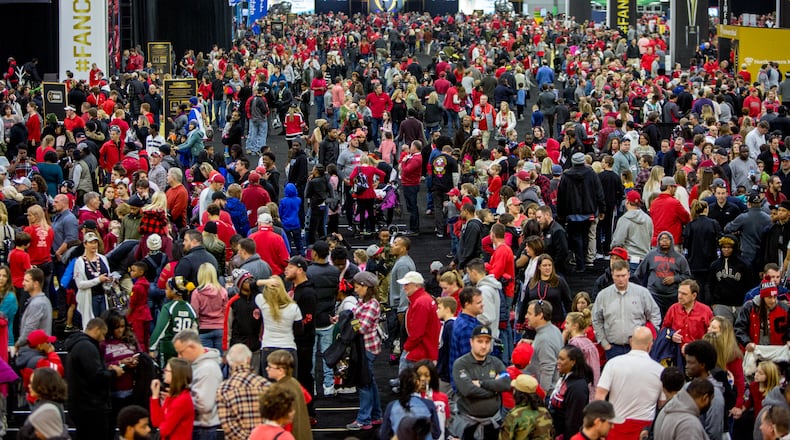 Fans crowd Playoff Fan Central in the Georgia World Congress Center in downtown Atlanta on Sunday. Phil Skinner/AJC