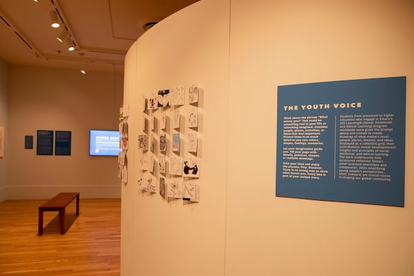 Student guests are encouraged to draw what moves them. "Fill your page with details, patterns, shapes or realistic drawings," they are prompted. "Every line is part of your unique story." Some of the drawings are displayed to the left of the wall text. (Isadora Pennington/Courtesy of ArtsATL)