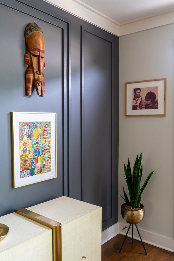 Amber Guyton's clients celebrate their heritage in this room decorated with tribal masks and a photograph of family members.
(Courtesy of Blessed Little Bungalow / Brittany Bah Photography)