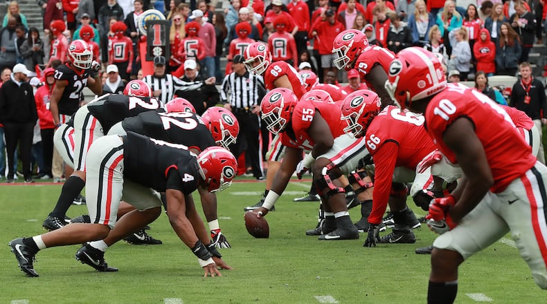 The Red and the Black face off at the line of scrimmage during Georgia's annual G-Day football game on Saturday, April 20, 2019, in Athens. Curtis Compton/ccompton@ajc.com