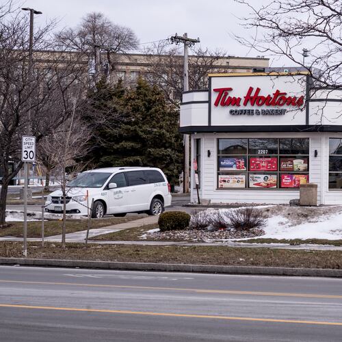 A vehicle rests in the parking lot of a Tim Horton's Coffee and Bakery shop, Friday, Feb. 27, 2026, in Buffalo, N.Y., the site where Nurul Amin Shah Alam, was dropped off after being released by Border Patrol agents last week. (AP Photo/Craig Ruttle)