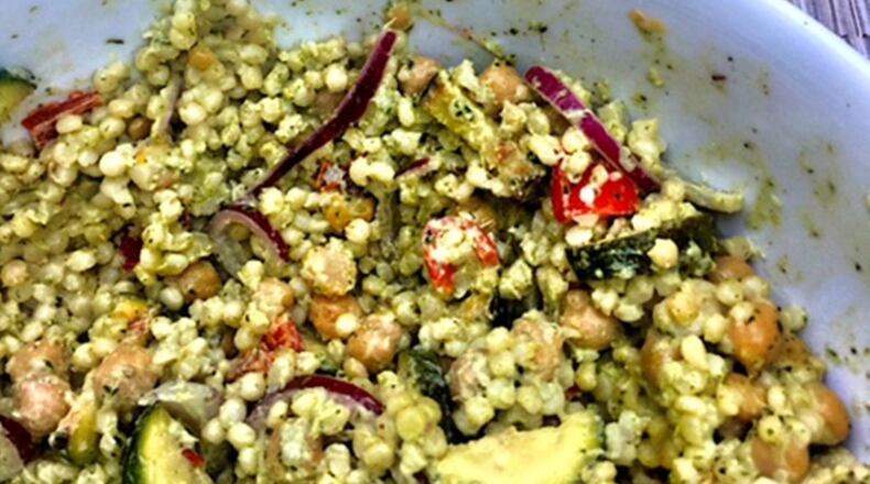 The larger grains of Israeli couscous combine with chickpeas, grilled vegetables and vibrant Green Goddess dressing come together in an excellent salad for late summer. (Kathleen Purvis/Charlotte Observer/TNS)