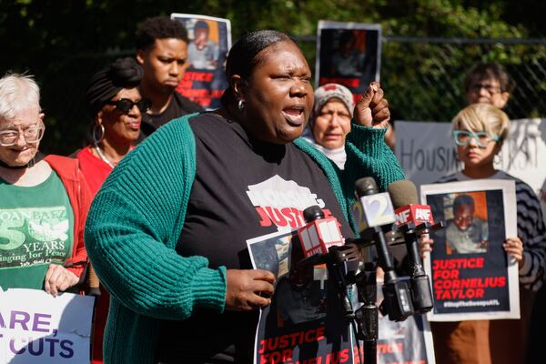 Alison Johnson, executive director of the Housing Justice League speaks during a press conference to protest city policies on clearing out the homeless at Old Wheat St. encampment in Atlanta on Monday, May 5, 2025. (Natrice Miller/AJC)