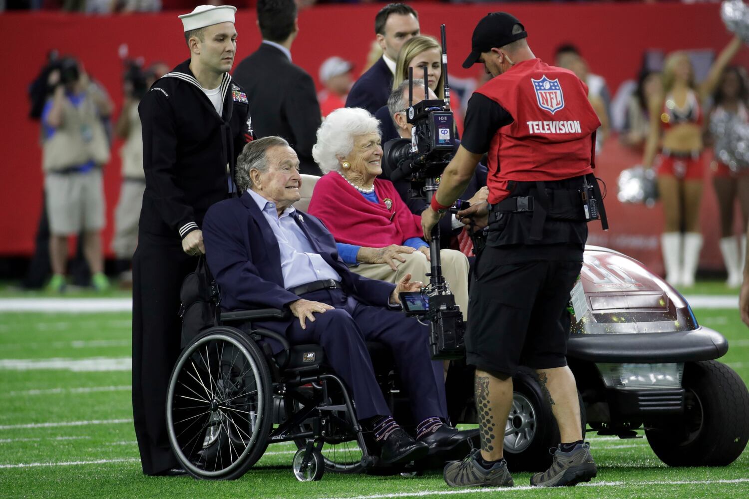 President George H.W. Bush flips coin at Super Bowl