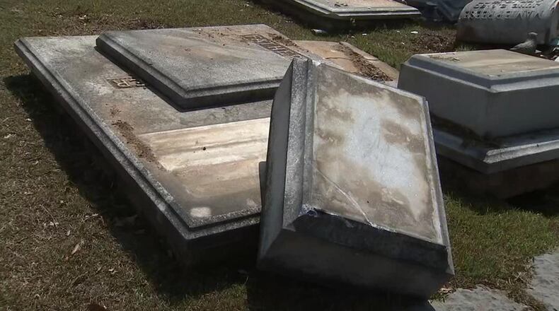 Several headstones were destroyed when an alleged drunk driver crashed into them. (Credit: Channel 2 Action News)