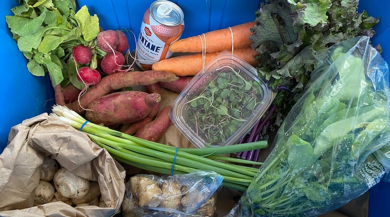 The core of Fresh Harvest's subscription-based weekly food delivery service is a customizable basket featuring locally grown, certified organic produce. Ligaya Figueras/ligaya.figueras@ajc.com