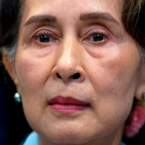 FILE - Myanmar's leader Aung San Suu Kyi waits to address judges of the International Court of Justice on the second day of three days of hearings in The Hague, Netherlands, on Dec. 11, 2019. (AP Photo/Peter Dejong, File)