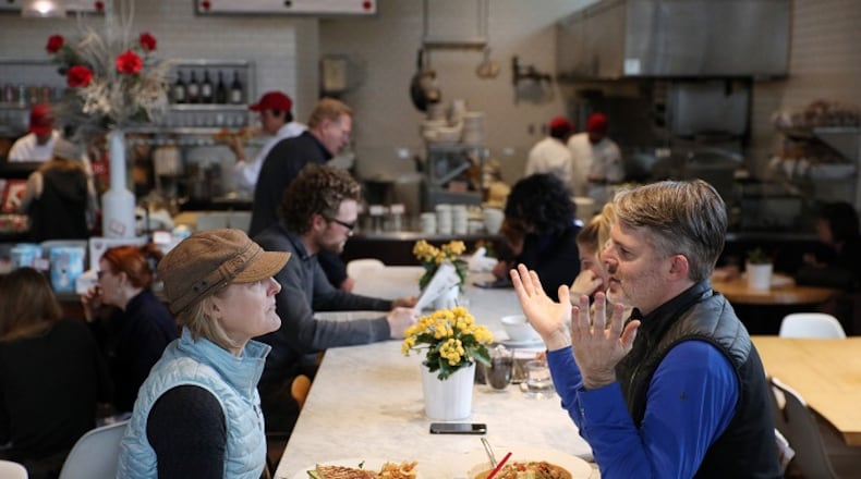 Kate Jackson and Michael Pilhofer sat at a communal table at Yum! Kitchen and Bakery in St. Louis Park, Minn. (Anthony Souffle/Minneapolis Star Tribune/TNS)