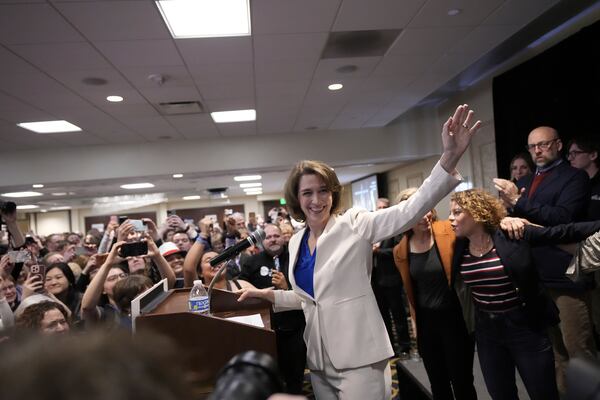 Wisconsin Supreme Court candidate Susan Crawford waves during her election night party after winning the election Tuesday, April 1, 2025, in Madison, Wis. (AP Photo/Kayla Wolf)