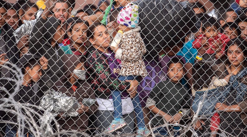 Migrants gathered recently in a makeshift detention center in El Paso, Texas. Border Patrol officials there said they are overwhelmed with those they already have in custody. Photo for The Washington Post by Sergio Flores