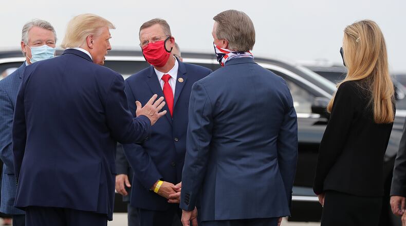 071520 Atlanta: Congressman Rick Allen (from left) President Donald Trump, Congressman Doug Collins, Senator David Perdue, and Senator Kelly Loeffler great each other as the president visits Georgia to talk about an infrastructure overhaul at the UPS Hapeville hub at Hartsfield-Jackson International Airport on Wednesday July 15, 2020 in Atlanta. The visit focuses on a rule change designed to make it easier to process environmental reviews. Curtis Compton ccompton@ajc.com