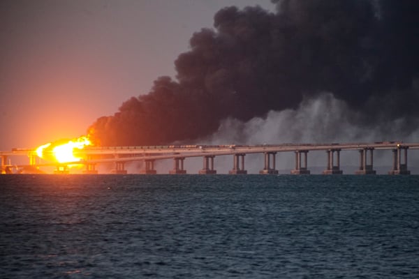 FILE - Flames and smoke rise from a bridge connecting Crimea and Russia in Kerch, on the Crimean peninsula, Oct. 8, 2022. (AP Photo, File)