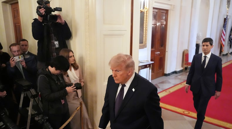 President Donald Trump, left, and Kevin Warsh arrive at a swearing-in ceremony for Warsh as Chairman of the Federal Reserve in the East Room of the White House, Friday, May 22, 2026, in Washington. (AP Photo/Alex Brandon)