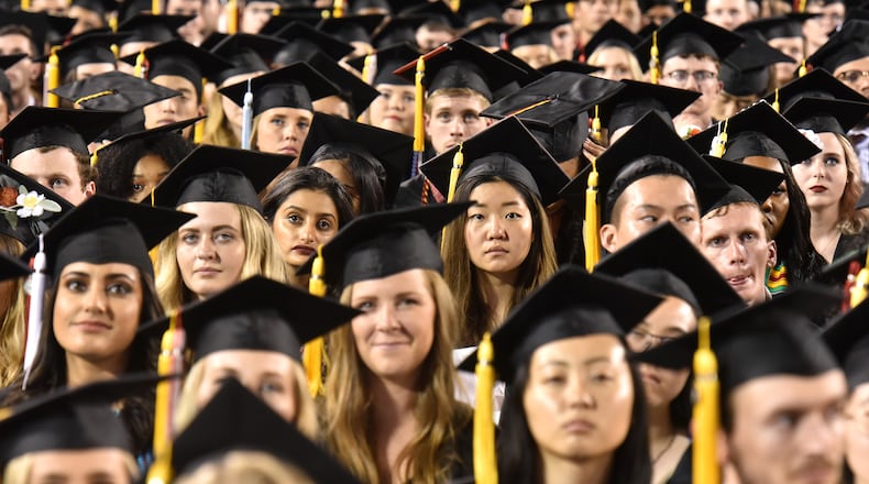 May 10, 2019 Athens - Students listen to commencement speaker Deborah Ann Roberts, news correspondent, during UGA's 2019 spring undergraduate commencement ceremony at Sanford Stadium in Athens on Friday, May 10, 2019. HYOSUB SHIN / HSHIN@AJC.COM