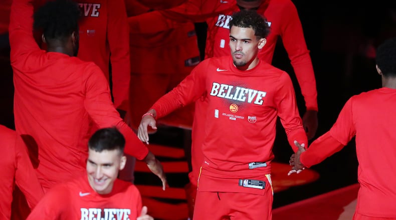Hawks guards Bogdan Bogdanovic (foreground) and Trae Young take the court to play the Milwaukee Bucks in Game 3 of the Eastern Conference finals Sunday, June 27, 2021, at State Farm Arena in Atlanta. (Curtis Compton / Curtis.Compton@ajc.com)