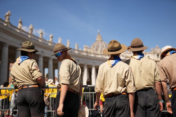 Boy Scouts participating in the Jubilee of Teenagers follow a mass on the second of nine days of mourning for late Pope Francis presided over by Vatican Secretary of State, Cardinal Pietro Parolin in St. Peter's Square at the Vatican, Sunday, April 27, 2025. (AP Photo/Francisco Seco)