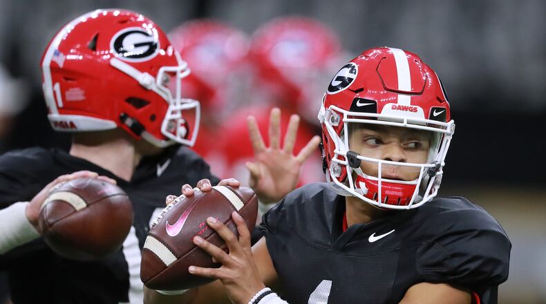 Quarterbacks Justin Fields (right) and Jake Fromm work out during a Georgia practice in 2018.  Fields has transferred to Ohio State.