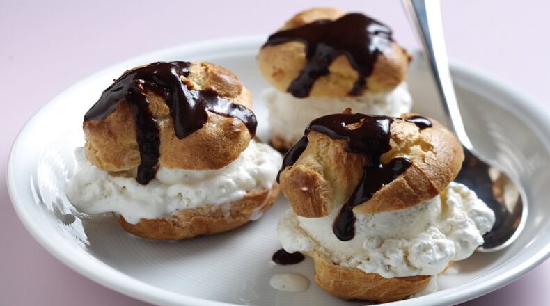 Little pastry puffs, stuffed with ice cream and doused in house-made chocolate syrup. (Abel Uribe/Chicago Tribune/TNS)