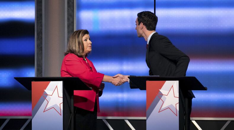 Candidates in Georgia’s 6th Congressional District race Republican Karen Handel, left, and Democrat Jon Ossoff shake hands after a debate Tuesday, June 6, 2017, in Atlanta. The two meet in a June 20 special election. (Branden Camp/Atlanta Journal-Constitution via AP)