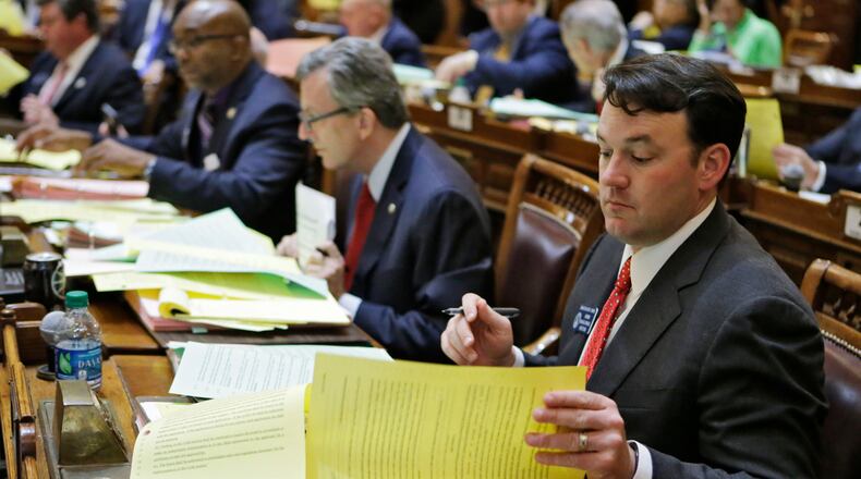 Mar. 24, 2016 - Atlanta - Senator Burt Jones looks over over some of the dozen of bills considered today. As this years general assembly comes to a close on the 40th day of the legislative session, legislators must consider scores of bills before the midnight deadline. BOB ANDRES / BANDRES@AJC.COM