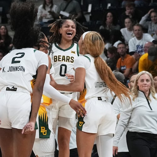 Baylor guard Taliah Scott (0) celebrates with teammates after an NCAA college basketball game against Duke Monday, Nov. 3, 2025 in Paris. (AP Photo/Thibault Camus)