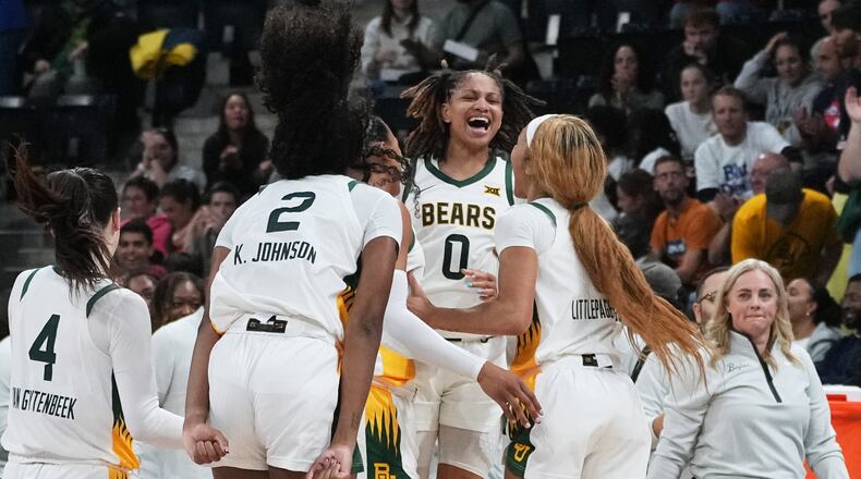Baylor guard Taliah Scott (0) celebrates with teammates after an NCAA college basketball game against Duke Monday, Nov. 3, 2025 in Paris. (AP Photo/Thibault Camus)