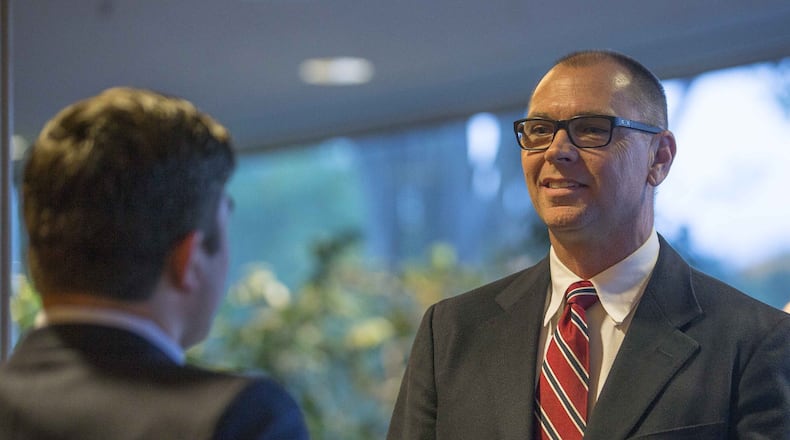 Gwinnett County School Board District 2 candidate Steven Knudsen speaks with someone before a candidate forum on Oct. 16, 2018. (ALYSSA POINTER/ALYSSA.POINTER@AJC.COM)