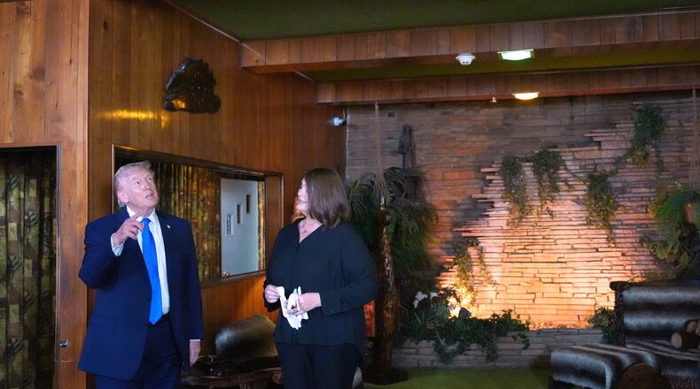 President Donald Trump tours the Jungle Room at Graceland, Elvis Presley's historic estate, Monday, March 23, 2026, in Memphis, Tenn. (AP Photo/Mark Schiefelbein)
