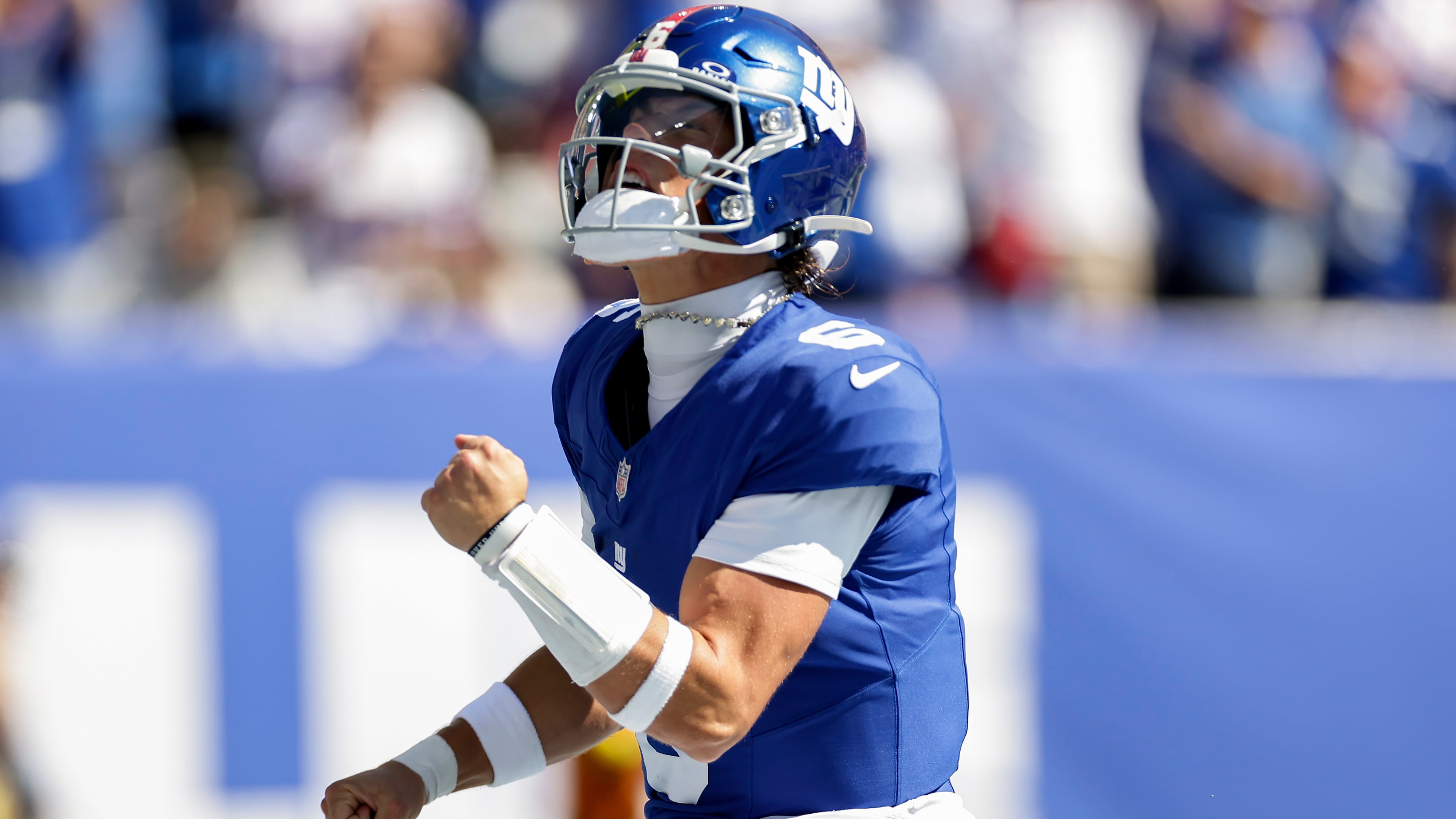 New York Giants quarterback Jaxson Dart (6) reacts after scoring a touchdown against the Los Angeles Chargers during the first quarter of an NFL football game, Sunday, Sept. 28, 2025, in East Rutherford, N.J. (AP Photo/Adam Hunger)