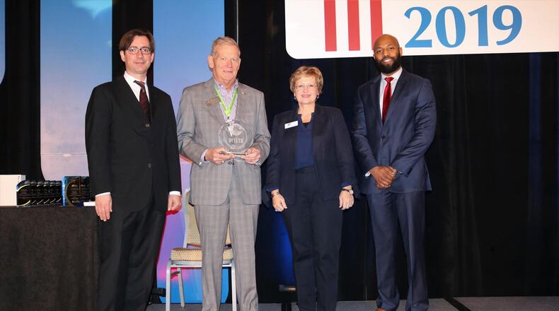 The Georgia Municipal Association presents a 2019 Live, Work, Play award to Duluth leaders at GMA’s annual Mayors’ Day Conference in Atlanta. (Courtesy City of Duluth)