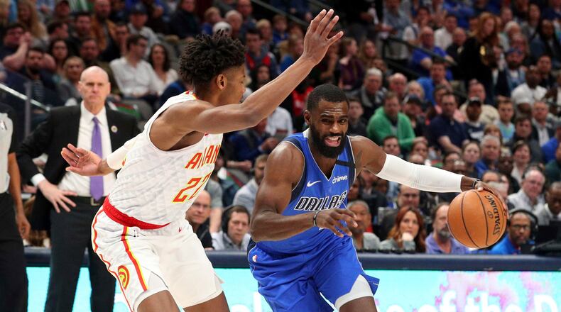 Atlanta Hawks guard Cam Reddish (22) guards Dallas Mavericks guard Tim Hardaway Jr. (11) in the first half Saturday, Feb. 1, 2020 in Dallas. Reddish left the game after taking contact to the face.
