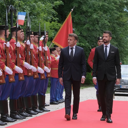 French President Emmanuel Macron, left, reviews the honor guard with Montenegro's President Jakov Milatovic during a welcome ceremony in Cetinje, Montenegro, Thursday, June 4, 2026. (AP Photo/Risto Bozovic)