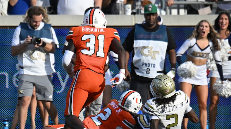 Georgia Tech wide receiver Eric Singleton Jr. (2) slides down in front of Miami defensive back Daryl Porter Jr. (2) at the end of the fourth quarter in an NCAA college football game at Georgia Tech's Bobby Dodd Stadium, Saturday, November 9, 2024, in Atlanta. Georgia Tech won 28-23 over Miami. (Hyosub Shin / AJC)