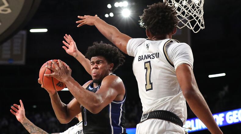 Duke forward Vernon Carey, Jr., grabs the offensive rebound in front of Georgia Tech forward James Banks III during the second half in a NCAA college basketball game on Wednesday, January 8, 2020, in Atlanta. Curtis Compton ccompton@ajc.com