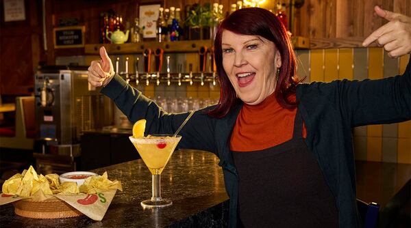 This photo released by Chili's shows actor Kate Flannery, who played Meredith Palmer in the TV series "The Office," posing in a soon-to-be opened Chili's in Dickson City, Pa. (Ben Rosenzweig, Chili's via AP)