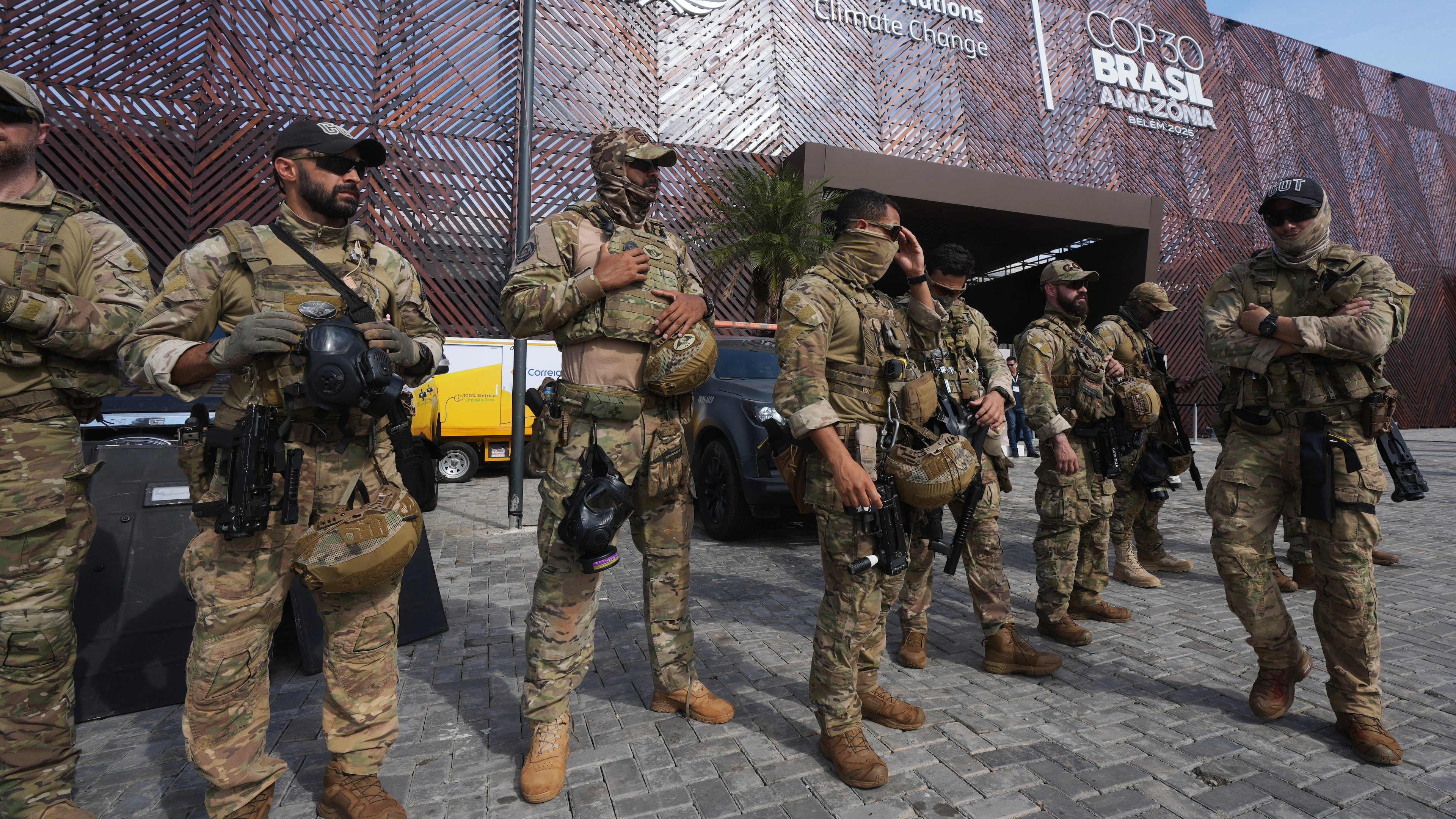 Security personnel work outside an entrance to the COP30 U.N. Climate Summit, Wednesday, Nov. 19, 2025, in Belem, Brazil. (AP Photo/Andre Penner)