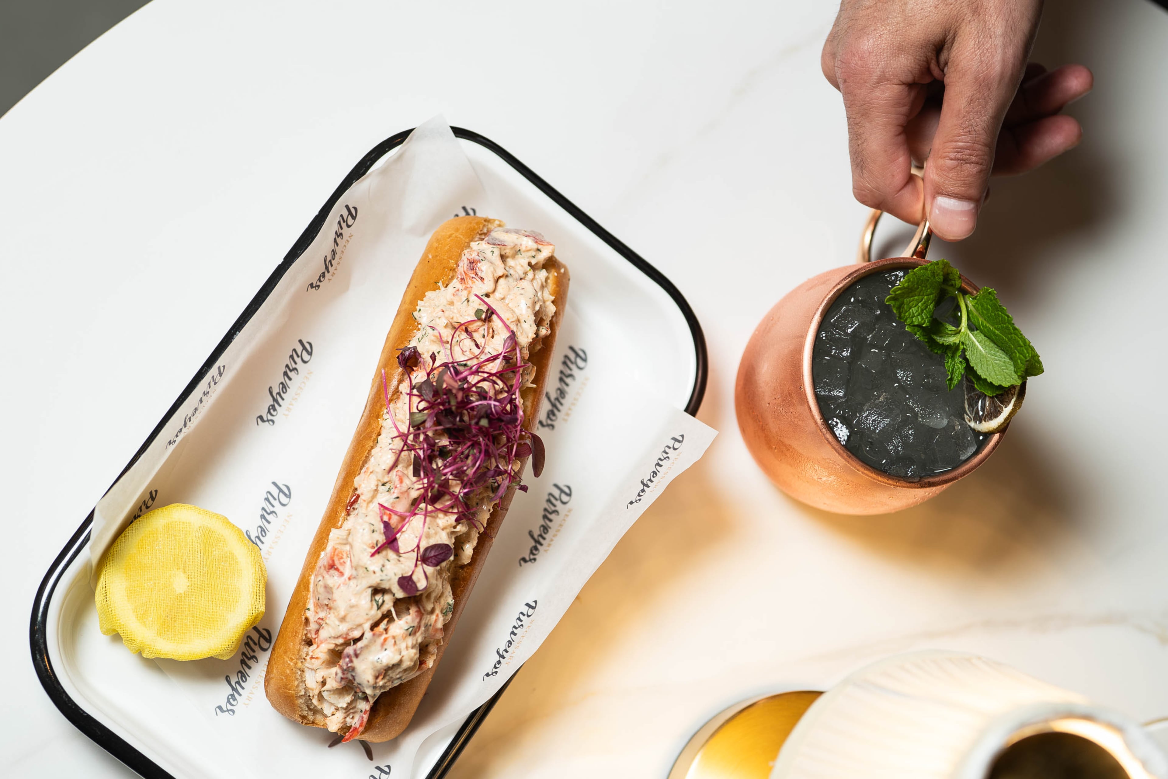Necessary Purveyor serves a very good lobster roll. (Courtesy of Jamestown)