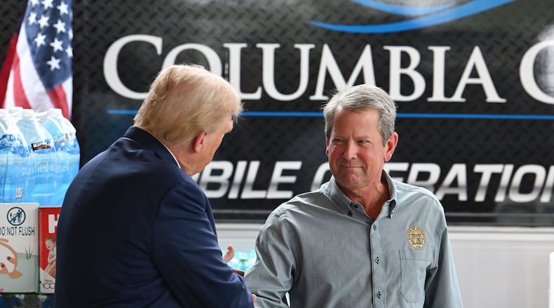 President Donald Trump meets with Gov. Brian Kemp while traveling to east Georgia to survey damage from Hurricane Helene, Friday, October 4, 2024, in Evans. (Hyosub Shin/AJC)