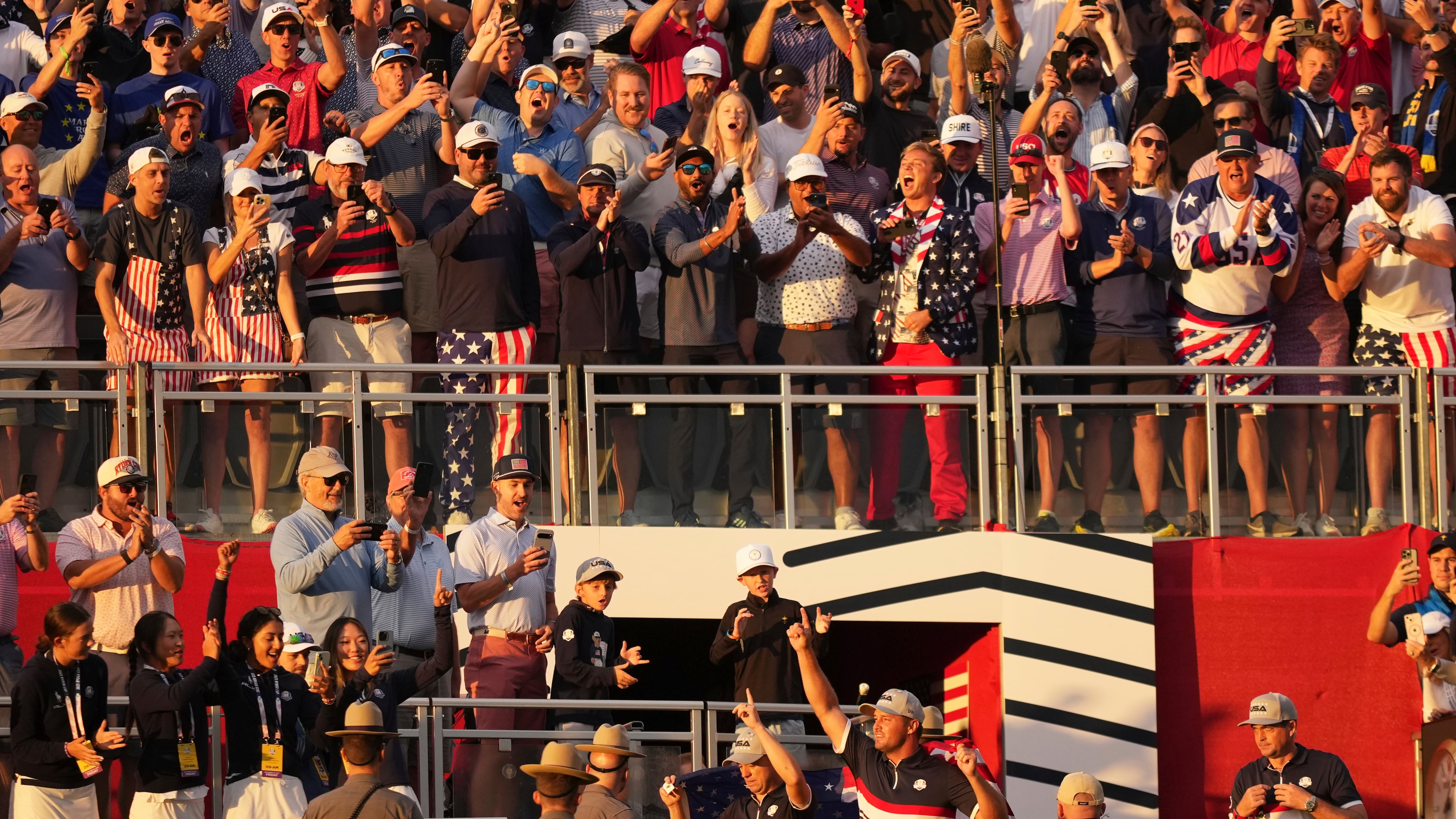 United States' Bryson DeChambeau and Justin Thomas wave to the crowd on the first hole at Bethpage Black golf course during the Ryder Cup golf tournament, Friday, Sept. 26, 2025, in Farmingdale, N.Y. (AP Photo/Matt Slocum)